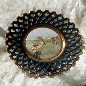 Black and Gold Decorative Plate with Pelican Design